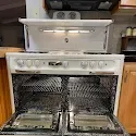Customer-uploaded photo of a vintage gas stove oven interior