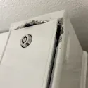 Customer-uploaded photo of a dryer coin box lock detail